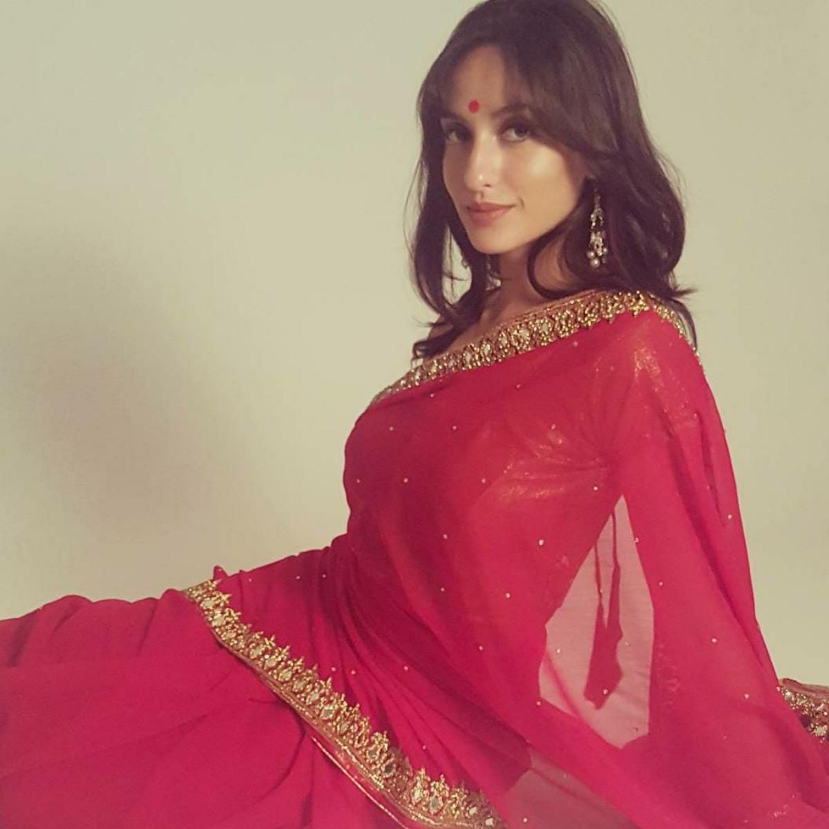 Nora Fatehi's Stunning Floral Saree Looks Nora Fatehi's Stunning Floral Saree Looks