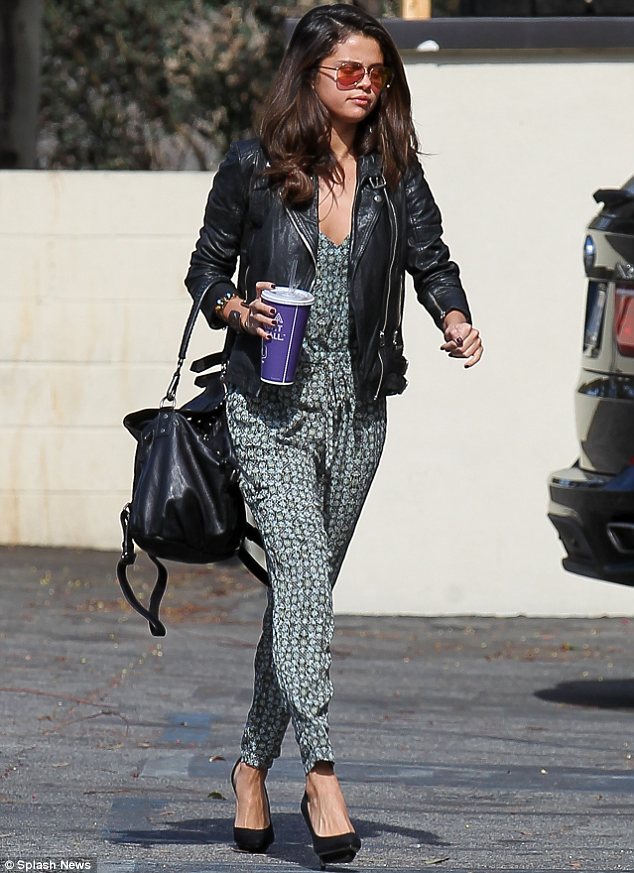 Selena Gomez's Edgy Look: Leather Dress And Boots Selena Gomez's Edgy Look: Leather Dress And Boots